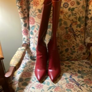 Beautiful red, snake skin look boots.